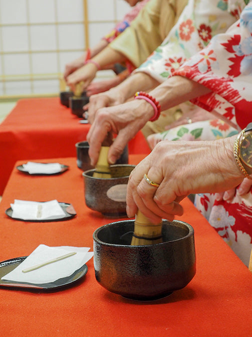 Whisking matcha in Kyoto Japan